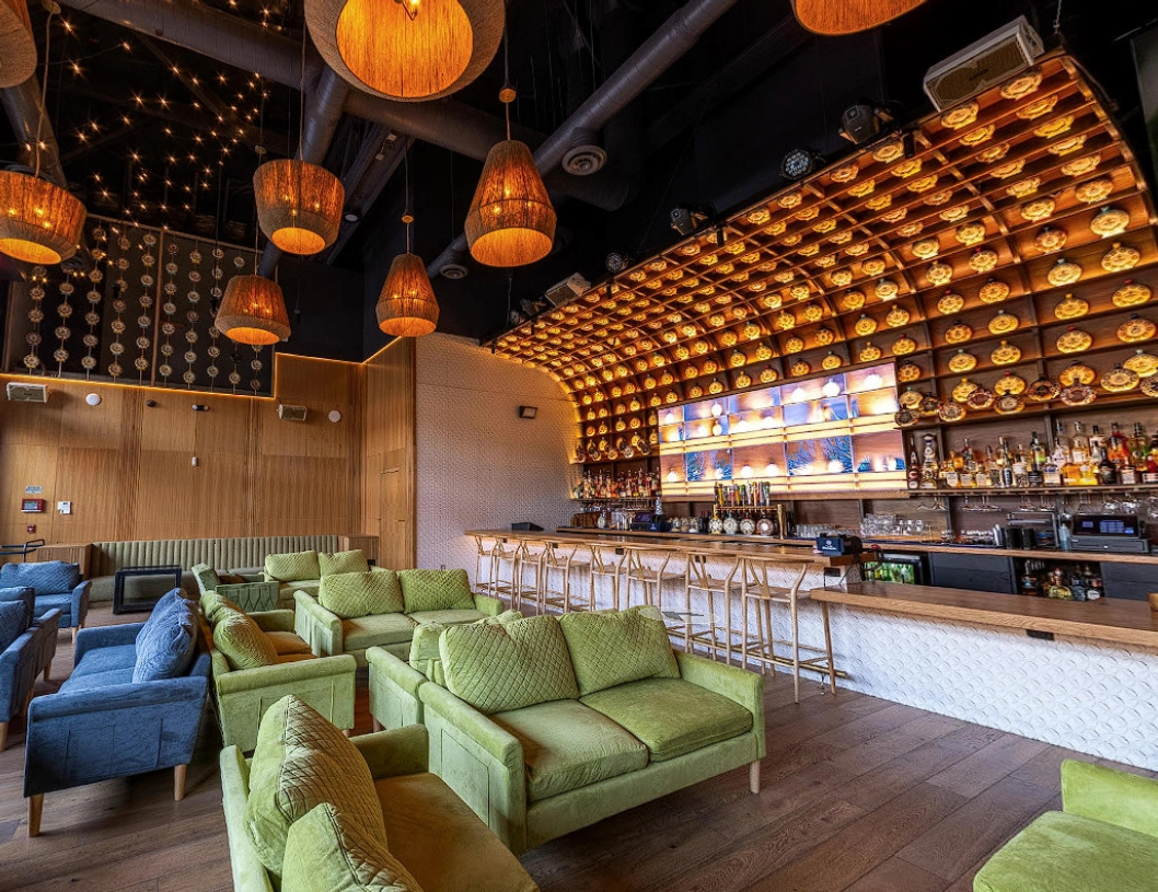 Mandala Cantina curved bar with lanterns